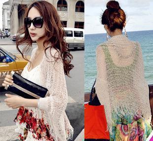 百搭時尚，夏日防曬新風尚——新款流蘇鏤空沙灘裙外罩衫